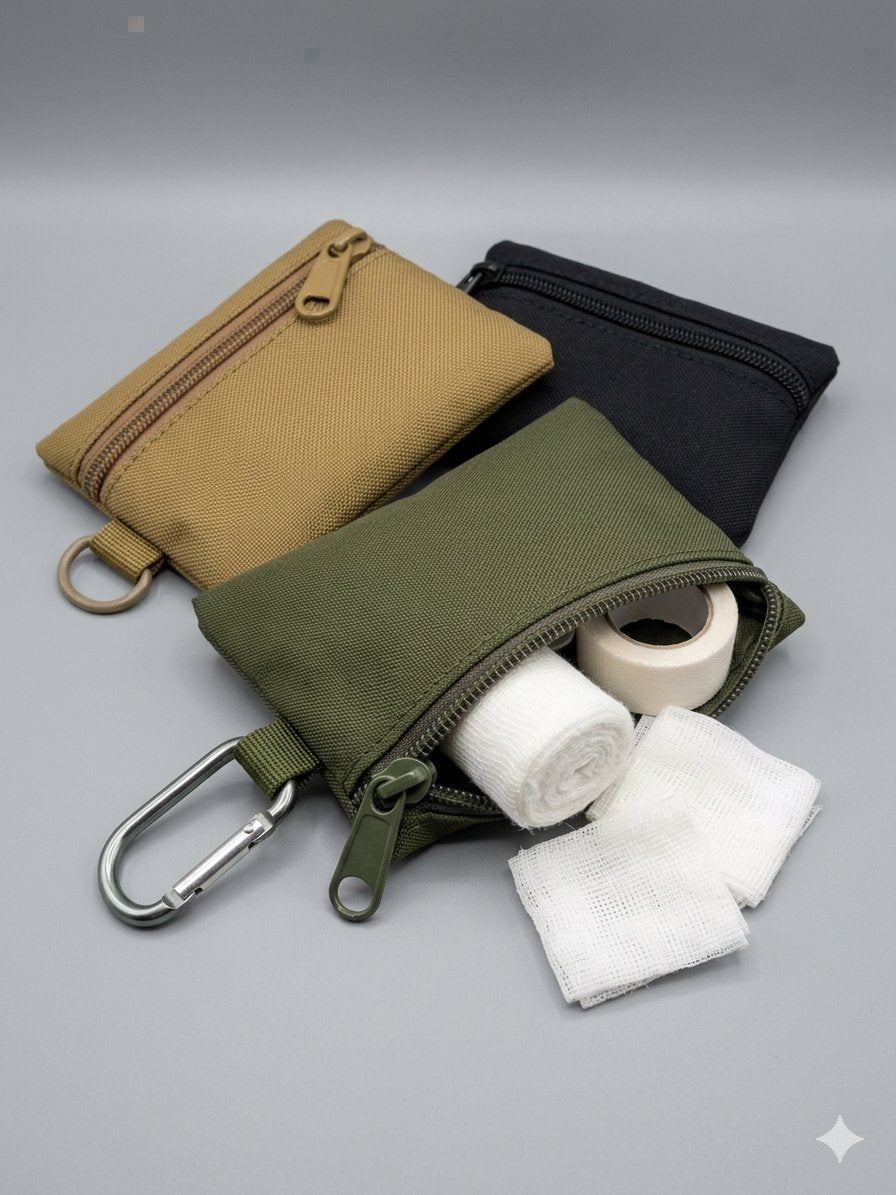 Three GFAK pouches open showing Burnshield and bandage contents